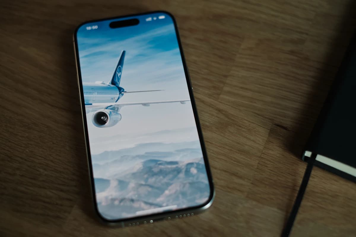 Smartphone on a wooden table showcasing mobile UI